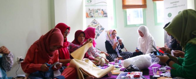 Grassroots women kneading and modeling soap-based dough during handicraft workshop