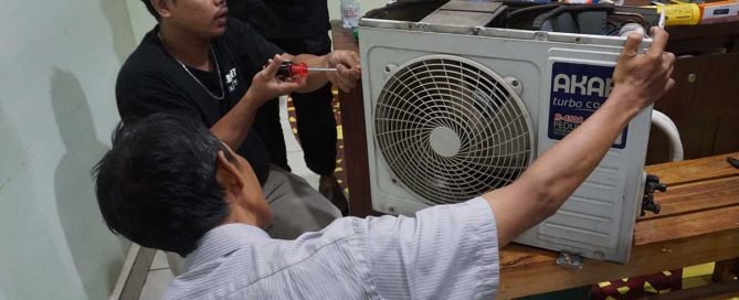 Participants practice air-conditioning cleaning and service skills