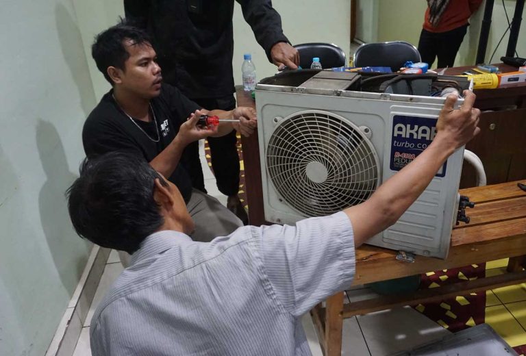 Participants building practical skills through a YIIM community empowerment program